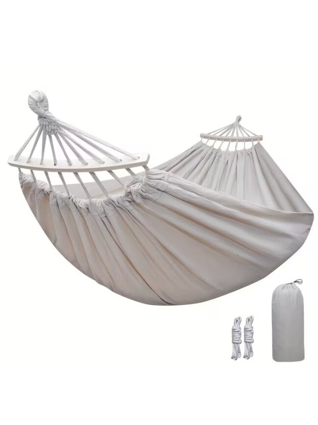 Outdoor canvas hammock with curved stabilization bars. 1 Outdoor canvas hammock with curved stabilization bars. 1