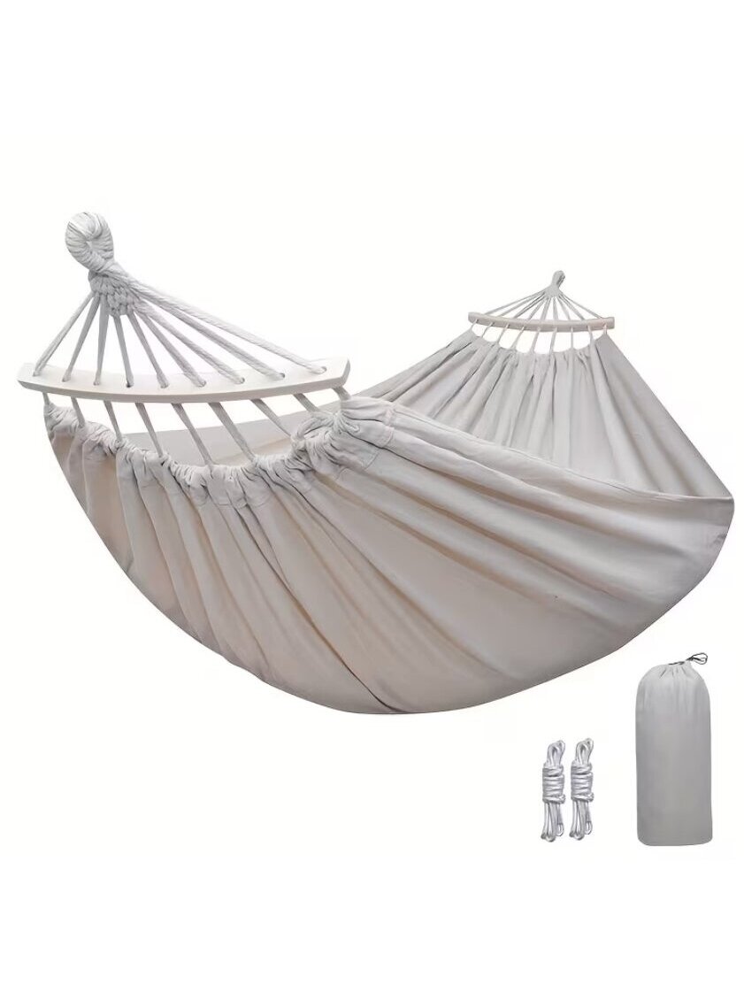 Outdoor canvas hammock with curved stabilization bars. 1 Outdoor canvas hammock with curved stabilization bars. 1